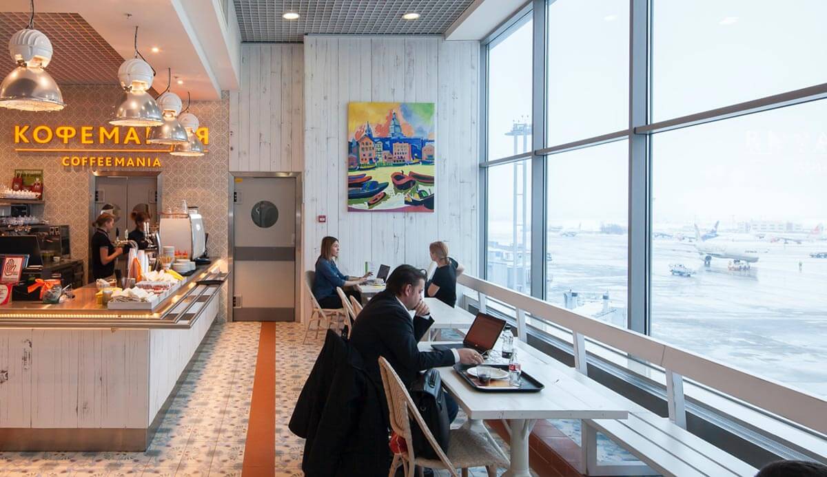 Grey swing door in airport restaurant